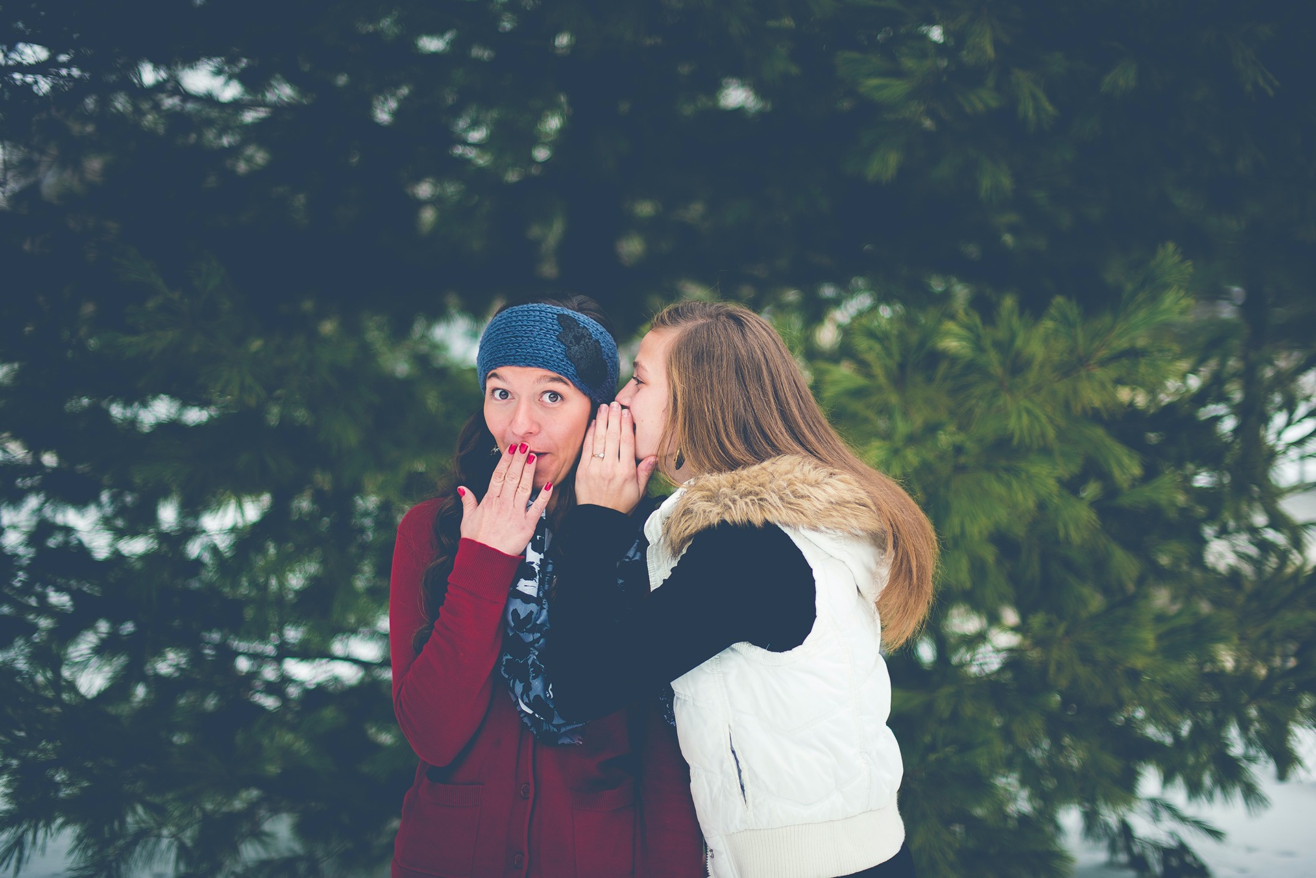 two girls sharing gossip