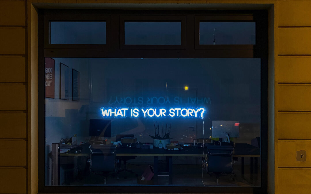 window with a neon sign that says what is your story